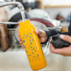 Person filling Choomi water bottle under the faucet